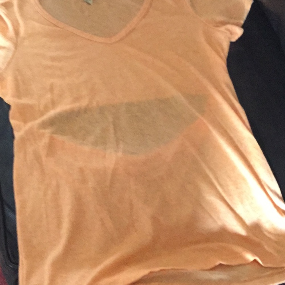 Melon colored shirt with open back. From Buckle.